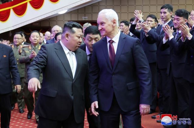 The North's leader Kim Jong-un (right) and Russian Defense Minister Andrei Belousov watching a cultural performance in Pyongyang on Friday. (KCNA)