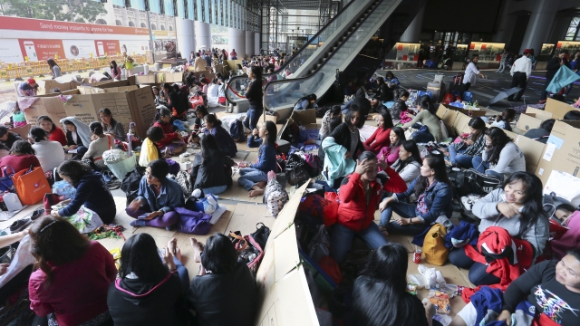 Foreign domestic workers meet on their day off in a public space in Central, Hong Kong, Nov. 12, 2017. (Dickson Lee/South China Morning Post via Getty Images)