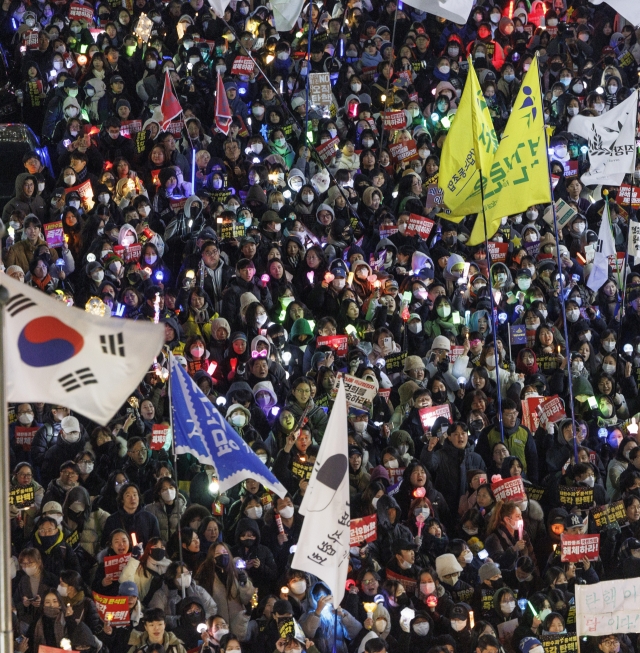 A protest rally demanding the impeachment of President Yoon Suk Yeol is held in front of the National Assembly on Dec. 11, Wednesday. (Yonhap)